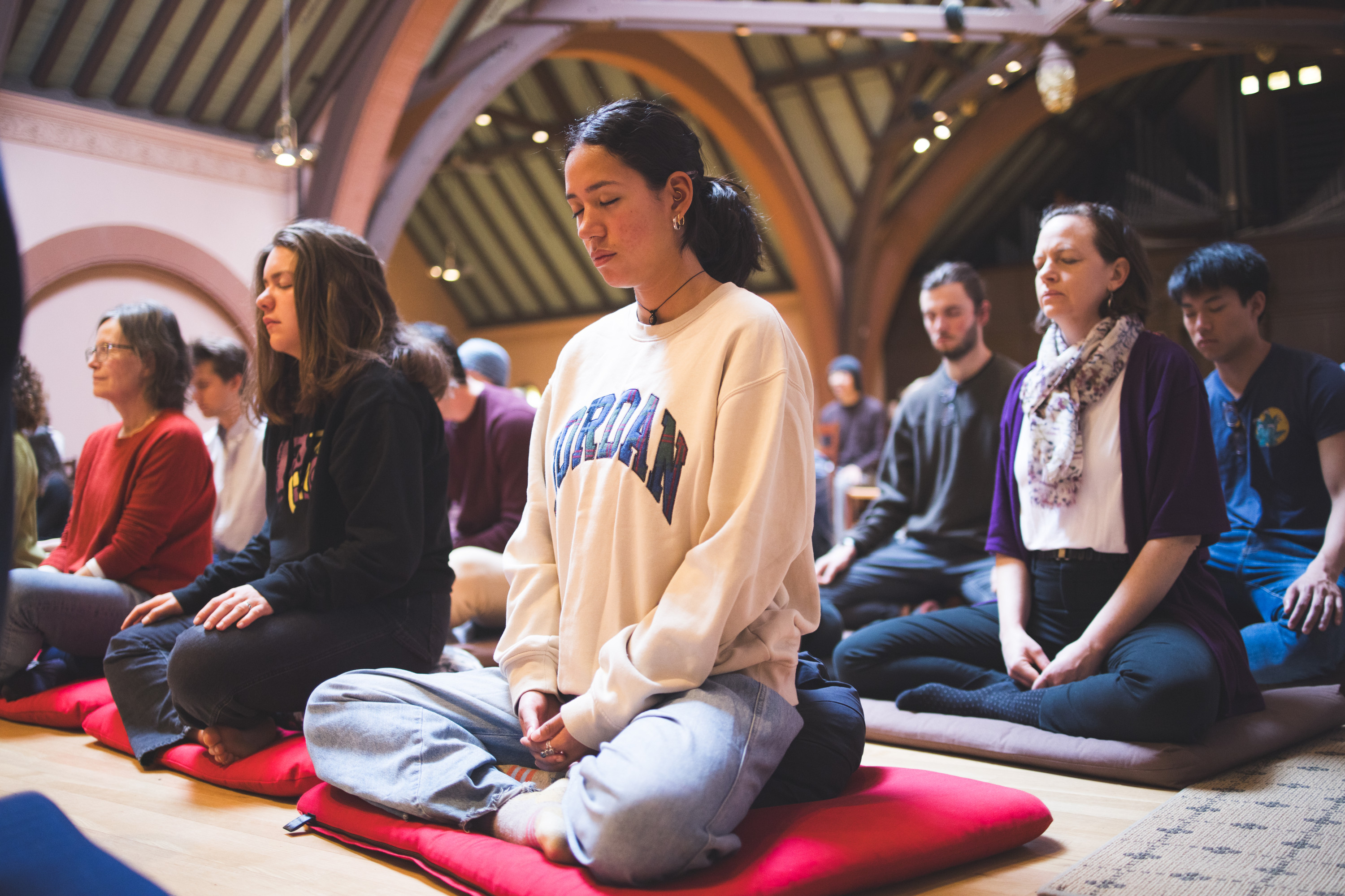 Students meditate in Rollins Chapel