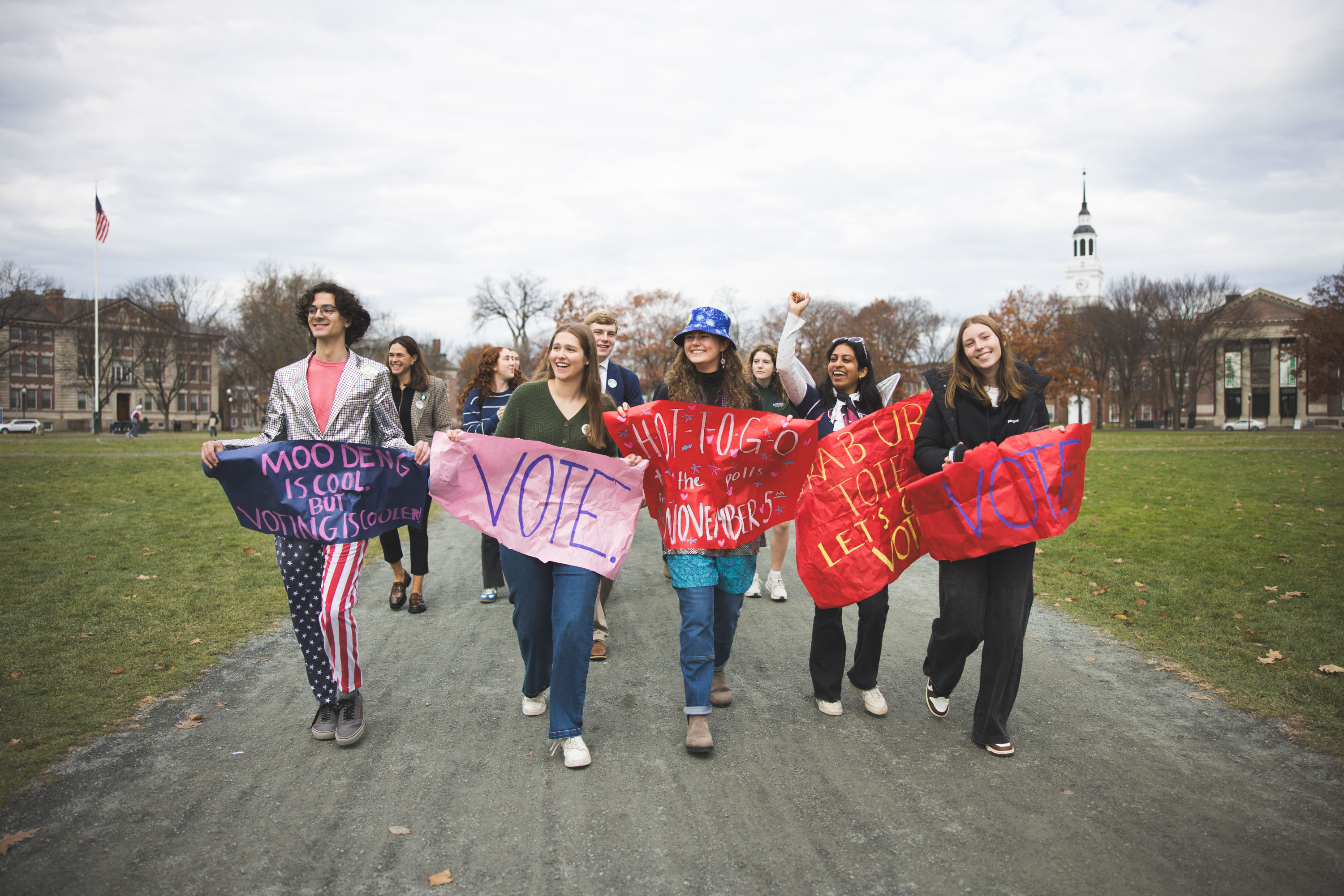 Students hold voting signs